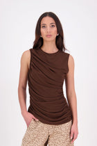 The N-E-S Lyla Mesh Tank is a sheer take on our popular Eva Tank, designed in a soft, stretch mesh. Featuring front ruching and a double-layered front for added coverage, this style falls just below the waistband for a flattering, easy-to-style fit. Perfect for layering or wearing as a statement on its own.