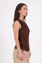 The N-E-S Lyla Mesh Tank is a sheer take on our popular Eva Tank, designed in a soft, stretch mesh. Featuring front ruching and a double-layered front for added coverage, this style falls just below the waistband for a flattering, easy-to-style fit. Perfect for layering or wearing as a statement on its own.