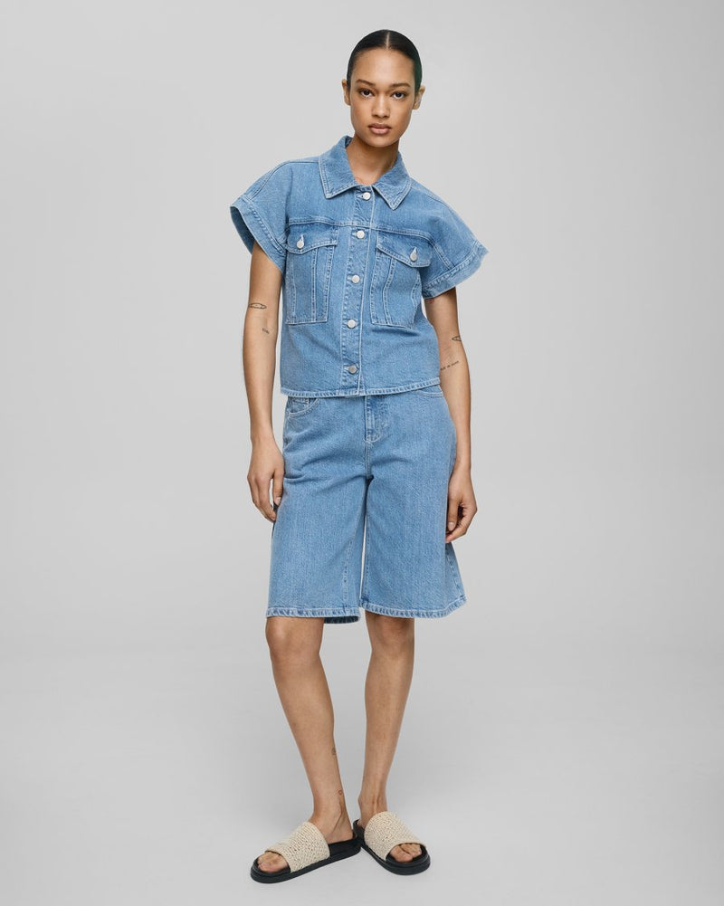 MSCH | ELIDA ADA DENIM SHORTS
The wait is over - the Bermuda short is back and better than ever. Crafted in classic light blue denim, these shorts feature a flattering longer length and a relaxed yet polished fit. Finished with front and back pockets, belt loops, and a traditional button-and-zip closure, they’re the ultimate warm weather staple. Timeless, effortless, and endlessly wearable - your must-have denim short for summer.