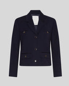 MSCH | ELINA BLAZER

A short, navy blue blazer with dark blue buttons with gold rim. These buttons is both down the front and on the cuffs. The blazer features a front pocket design inspired by a military jacket. Style it with a pair of jeans for a cool and causal look or with the matching skirt.

This blazer has a boxy fit. The model is 177cm and wears a size S.

Composition: 50% Recycled Polyester, 35% Viscose &amp; 15% Polyester
