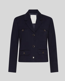 MSCH | ELINA BLAZER

A short, navy blue blazer with dark blue buttons with gold rim. These buttons is both down the front and on the cuffs. The blazer features a front pocket design inspired by a military jacket. Style it with a pair of jeans for a cool and causal look or with the matching skirt.

This blazer has a boxy fit. The model is 177cm and wears a size S.

Composition: 50% Recycled Polyester, 35% Viscose &amp; 15% Polyester