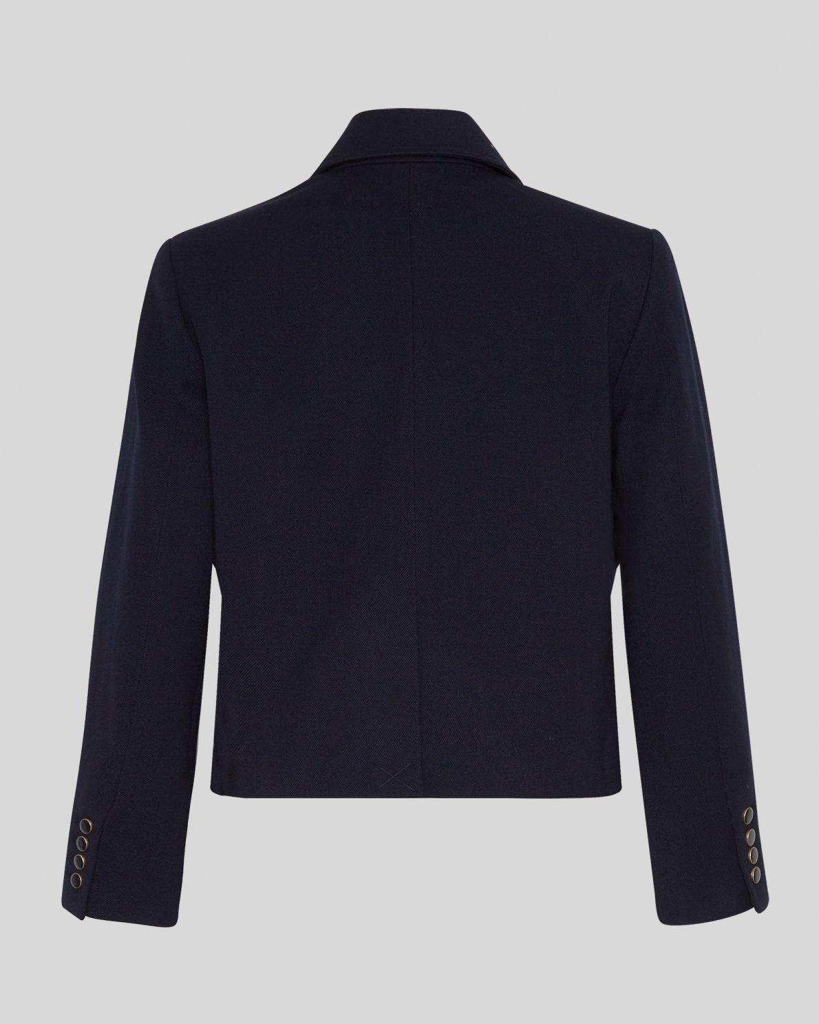 MSCH | ELINA BLAZER

A short, navy blue blazer with dark blue buttons with gold rim. These buttons is both down the front and on the cuffs. The blazer features a front pocket design inspired by a military jacket. Style it with a pair of jeans for a cool and causal look or with the matching skirt.

This blazer has a boxy fit. The model is 177cm and wears a size S.

Composition: 50% Recycled Polyester, 35% Viscose &amp; 15% Polyester