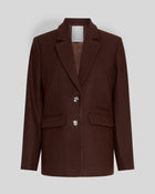 MSCH Copenhagen ELLIOT Loose Blazer in brown with a straight structured silhouette and classic notched lapels. Features a front button closure, flap pockets and full lining for a smooth tailored finish. Crafted from a recycled polyester, wool and viscose blend.