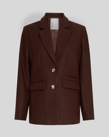 MSCH Copenhagen ELLIOT Loose Blazer in brown with a straight structured silhouette and classic notched lapels. Features a front button closure, flap pockets and full lining for a smooth tailored finish. Crafted from a recycled polyester, wool and viscose blend.