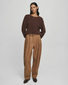 MSCH Copenhagen GWENETH DW Pants in a rich caramel colour with a high waist and relaxed regular fit barrel-leg silhouette. Designed with front pleats, elastic side inserts, belt loops, button and zip closure, and back flap pockets with button detailing. Crafted from a soft lyocell and cotton blend for effortless everyday wear.