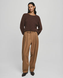 MSCH Copenhagen GWENETH DW Pants in a rich caramel colour with a high waist and relaxed regular fit barrel-leg silhouette. Designed with front pleats, elastic side inserts, belt loops, button and zip closure, and back flap pockets with button detailing. Crafted from a soft lyocell and cotton blend for effortless everyday wear.