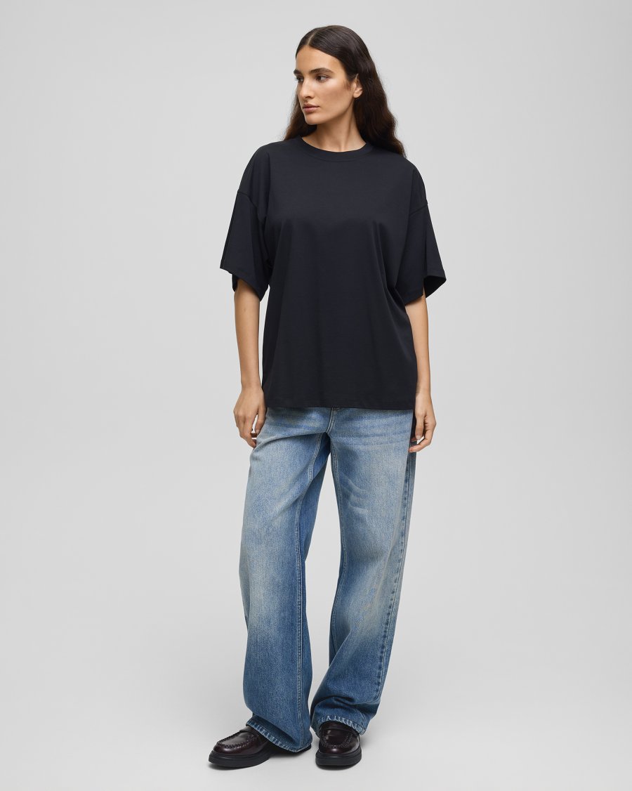 MSCH Kinsey Melea Tee in black by MSCH Copenhagen. Oversized organic cotton T-shirt with a round neckline, dropped shoulders and short sleeves for a relaxed boxy fit. Soft everyday staple in 100% organic cotton.