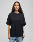 MSCH Kinsey Melea Tee in black by MSCH Copenhagen. Oversized organic cotton T-shirt with a round neckline, dropped shoulders and short sleeves for a relaxed boxy fit. Soft everyday staple in 100% organic cotton.