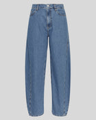 MSCH Copenhagen KOBANE LIS Barrel Jeans in washed blue denim with a loose barrel-leg fit, mid waist and tapered ankle. Features classic five-pocket styling, visible stitching, belt loops and zip button closure.