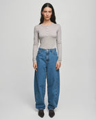 MSCH Copenhagen KOBANE LIS Barrel Jeans in washed blue denim with a loose barrel-leg fit, mid waist and tapered ankle. Features classic five-pocket styling, visible stitching, belt loops and zip button closure.