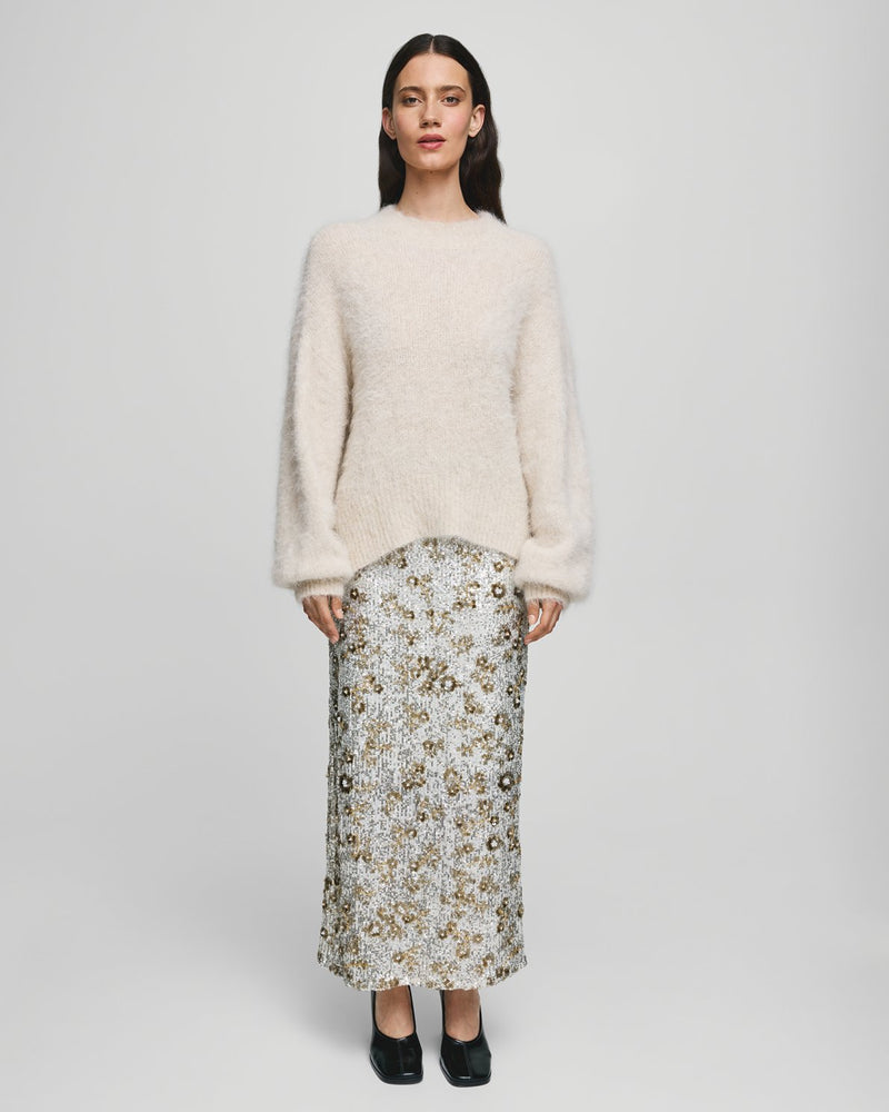 MSCH Copenhagen Magnolia Skirt with shimmering sequin detailing, designed in a flattering high waisted silhouette with a straight cut fit. Crafted from a comfortable polyester and elastane blend, this statement skirt adds a touch of glamour to both casual styling and elevated evening looks.