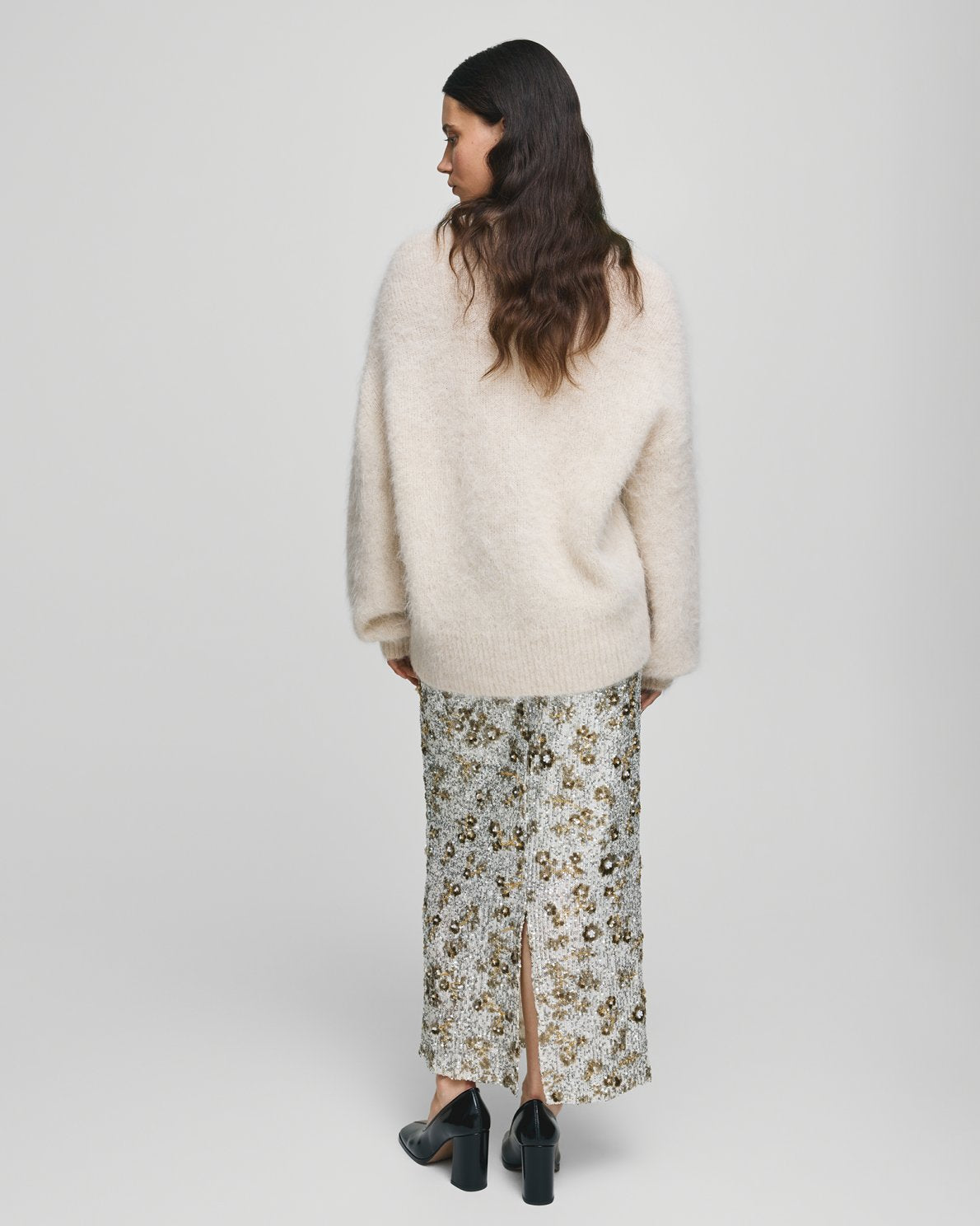 MSCH Copenhagen Magnolia Skirt with shimmering sequin detailing, designed in a flattering high waisted silhouette with a straight cut fit. Crafted from a comfortable polyester and elastane blend, this statement skirt adds a touch of glamour to both casual styling and elevated evening looks.