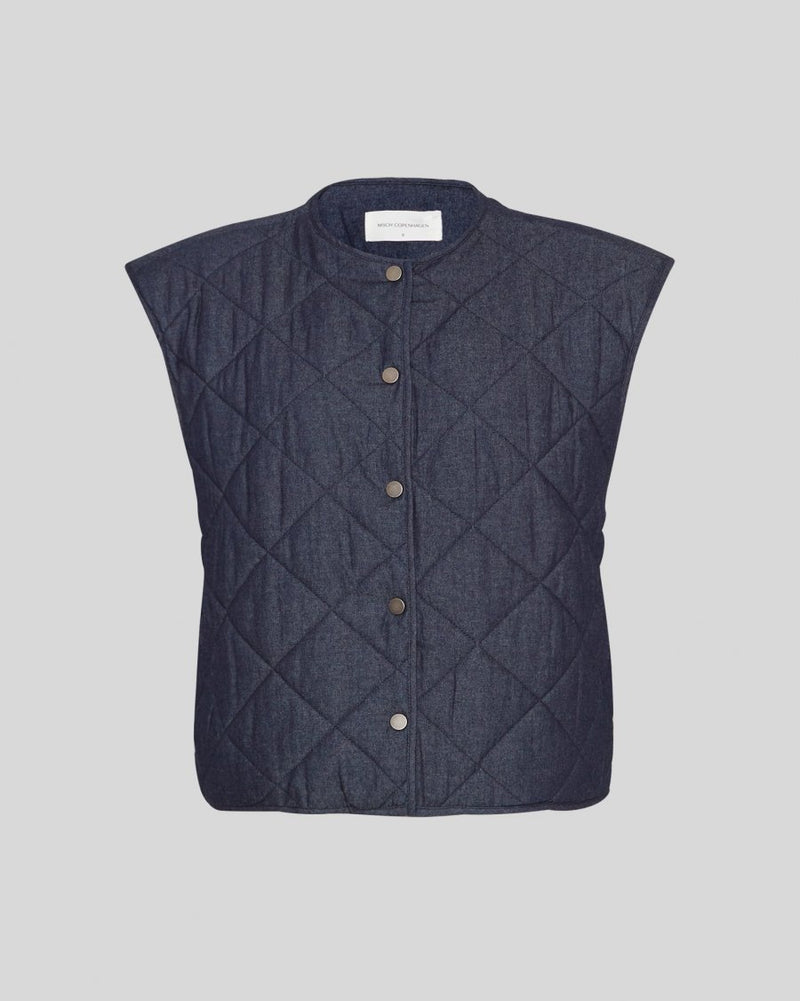Quilted Vest
Looking for a cute light jacket? Our newest addition to our outerwear collection is here and it's a lightweight MSCH Meika Lysandra cotton vest, in a quilted denim look. It features side pockets, cool front buttons and a round neckline. This can replace a blazer in an indoor outfit or be worn as a spring accessory.

This vest has a boxy fit.

Composition
100% Cotton