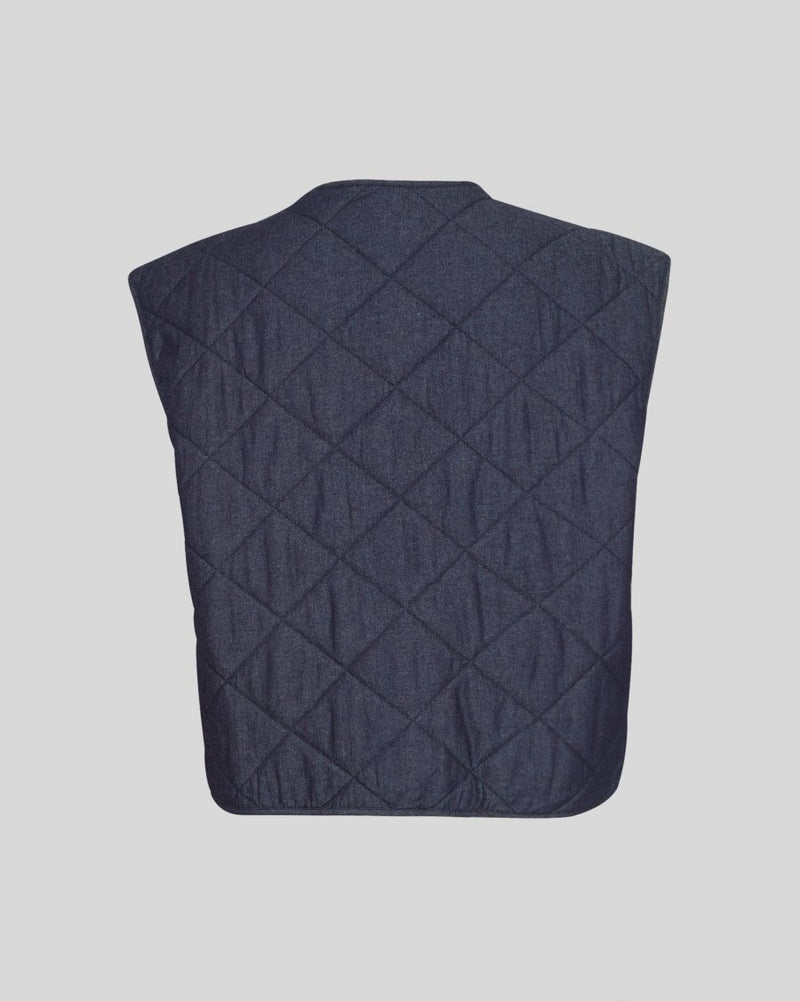 Quilted Vest
Looking for a cute light jacket? Our newest addition to our outerwear collection is here and it's a lightweight MSCH Meika Lysandra cotton vest, in a quilted denim look. It features side pockets, cool front buttons and a round neckline. This can replace a blazer in an indoor outfit or be worn as a spring accessory.

This vest has a boxy fit.

Composition
100% Cotton