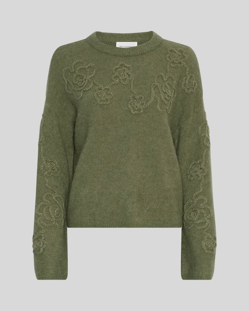 MSCH Copenhagen Miabelle Hope Pullover EMB in muted olive green with embroidered floral detailing and a relaxed boxy fit. Designed with a round neckline and classic long sleeves, crafted from a soft blend of wool, alpaca, acrylic, recycled polyester, polyester, and elastane for a cosy everyday feel.