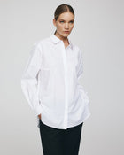 MSCH Copenhagen Olisa Shirt in white, crafted from 100% organic cotton with a loose fit and smooth finish. Features a classic pointed collar, full button front closure, long sleeves with buttoned cuffs, and a softly curved hem for an effortless everyday style.