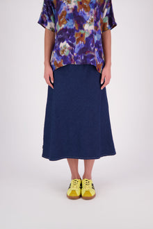 N-E-S Denim Muse Skirt
Our bestselling Muse Skirt gets a fresh update in classic denim with crisp white topstitching along the hemline. Designed with a flattering bias cut, wide elasticated waistband, and signature concave front with a dropped back hem, this skirt offers effortless style and all-day comfort. A versatile, multi-seasonal staple you’ll reach for again and again.