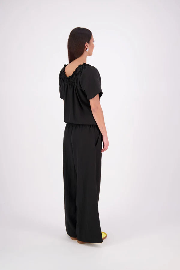 The N-E-S Muses Jumpsuit features a shirred off-the-shoulder top with cap sleeves, an elasticated back waist, and a self-drawcord front for a flattering, adjustable fit. The lower half mirrors the relaxed fit of our Lounge Jumpsuit, with angled seams, centre front detailing, and practical front pockets—plus 5cm added length for extra ease. Wear it your way: off the shoulders, asymmetrical, or pulled up for a more classic neckline.
lyocell,rayon,nylon,linen (anti-crease)
Designed & made in New Zealand
