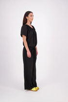 The N-E-S Muses Jumpsuit features a shirred off-the-shoulder top with cap sleeves, an elasticated back waist, and a self-drawcord front for a flattering, adjustable fit. The lower half mirrors the relaxed fit of our Lounge Jumpsuit, with angled seams, centre front detailing, and practical front pockets—plus 5cm added length for extra ease. Wear it your way: off the shoulders, asymmetrical, or pulled up for a more classic neckline.
lyocell,rayon,nylon,linen (anti-crease)
Designed & made in New Zealand