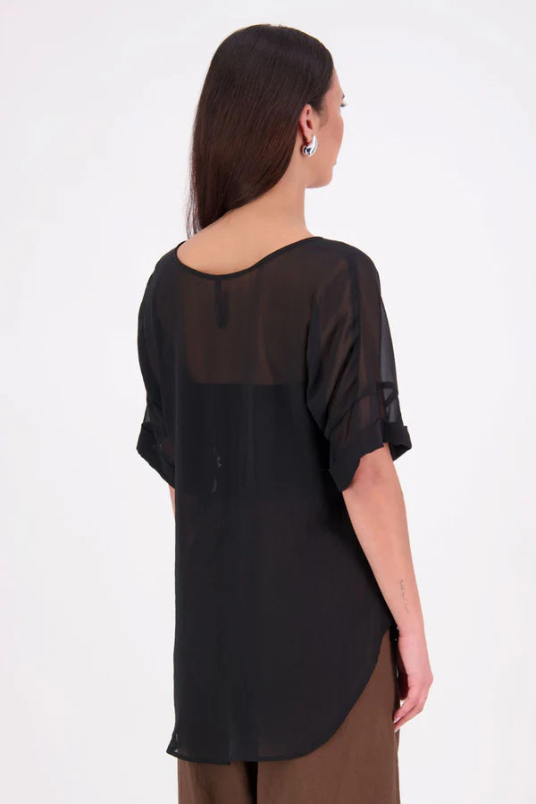 A customer favourite, the NES Cross Top is crafted in lightweight chiffon for an easy, elegant drape. This flattering t-shirt style features mid-length sleeves with folded cuffs, a soft scooped hem, and a unique crossover yoke detail that wraps from front to back. Perfect dressed up or down, and best layered with a NES Lattice Singlet underneath for coverage and style.

Our model is 174cm and wears a XS (8) NES fit advise: Standard fit

Composition: PT Chiffon

Designed and Made in New Zealand