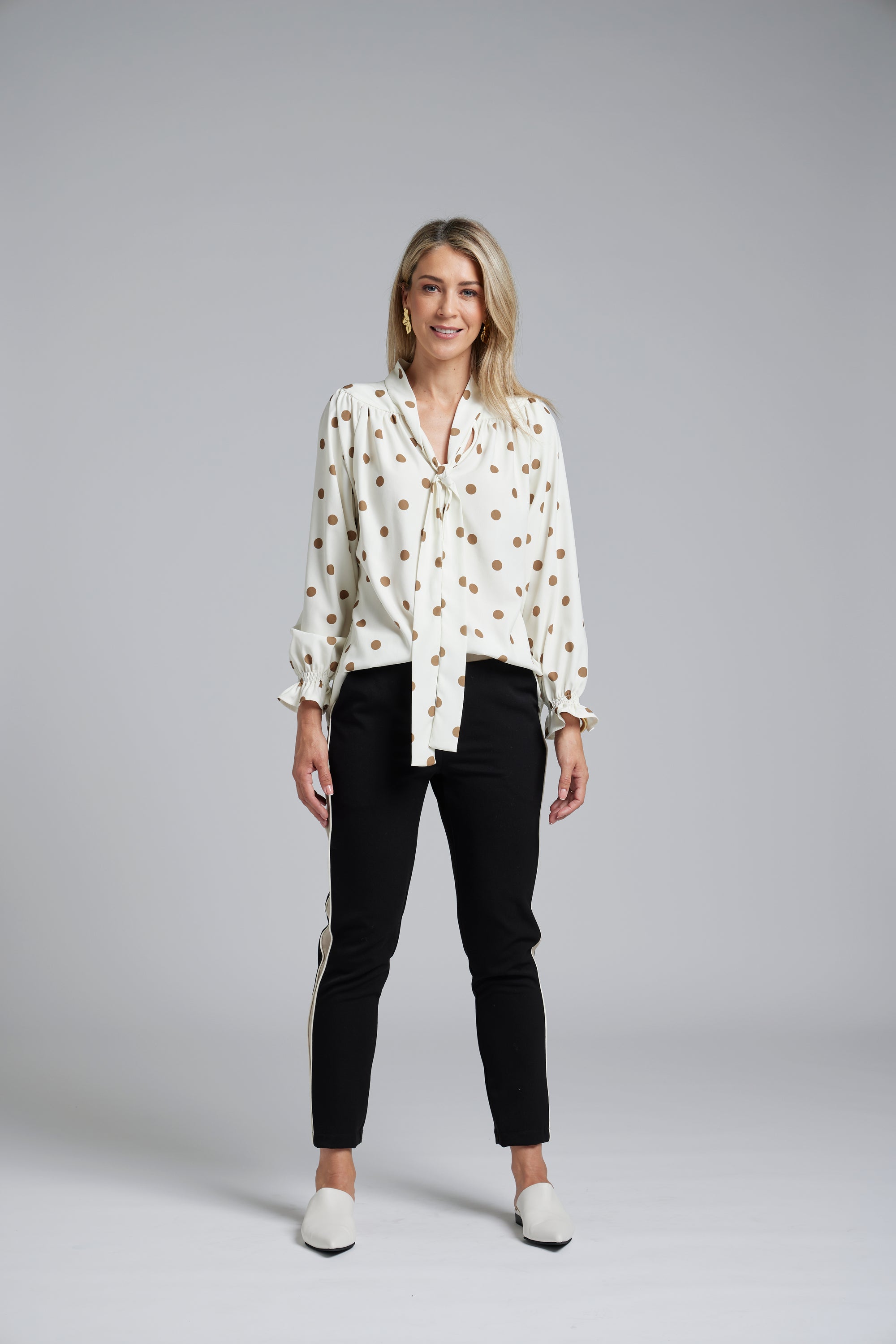 The NES Esme Top by N-E-S – a soft, drapey top with curved hem, available in viscose polka dot georgette or ivory satin back crepe. NZ made.