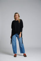 The NES Merino Vanotti Top – a warm merino take on the N-E-S favourite with cigarette sleeves, scoop neck and signature draped hem. NZ made.