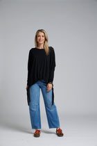The NES Merino Vanotti Top – a warm merino take on the N-E-S favourite with cigarette sleeves, scoop neck and signature draped hem. NZ made.