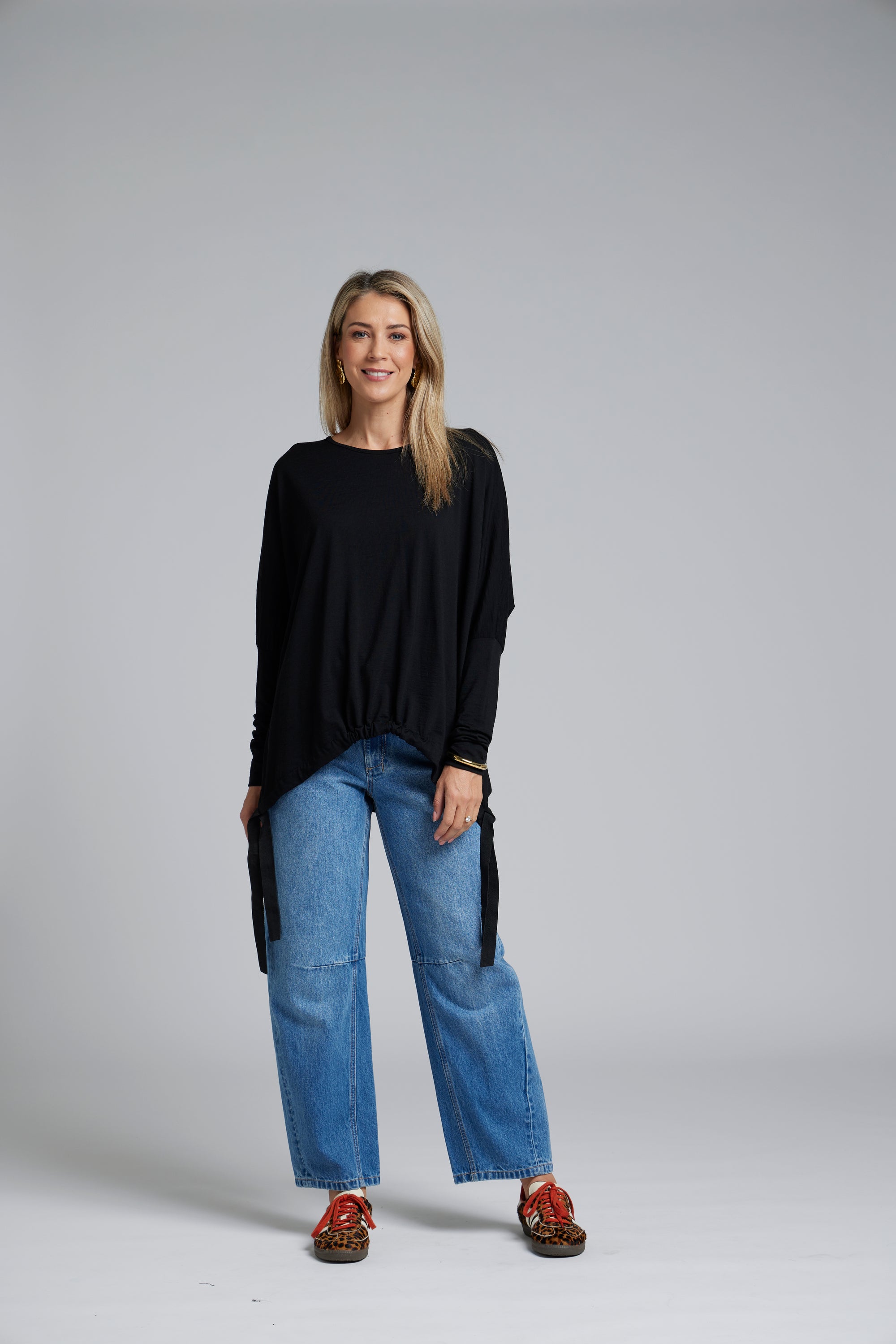 The NES Merino Vanotti Top – a warm merino take on the N-E-S favourite with cigarette sleeves, scoop neck and signature draped hem. NZ made.