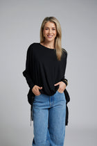 The NES Merino Vanotti Top – a warm merino take on the N-E-S favourite with cigarette sleeves, scoop neck and signature draped hem. NZ made.