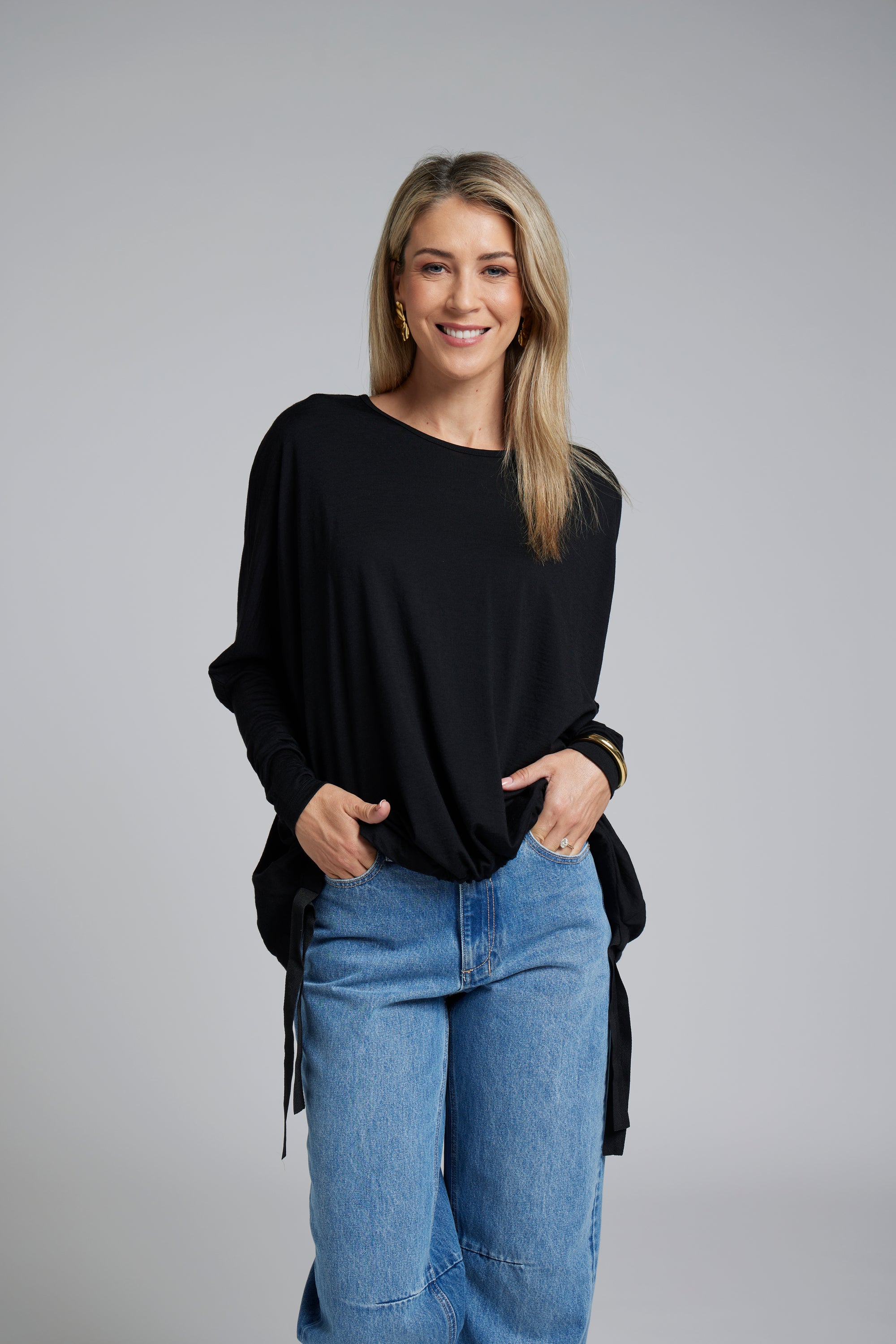 The NES Merino Vanotti Top – a warm merino take on the N-E-S favourite with cigarette sleeves, scoop neck and signature draped hem. NZ made.