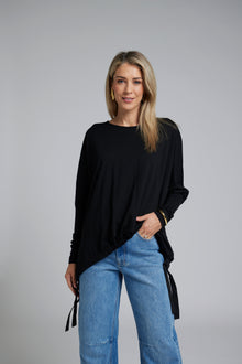 The NES Merino Vanotti Top – a warm merino take on the N-E-S favourite with cigarette sleeves, scoop neck and signature draped hem. NZ made.