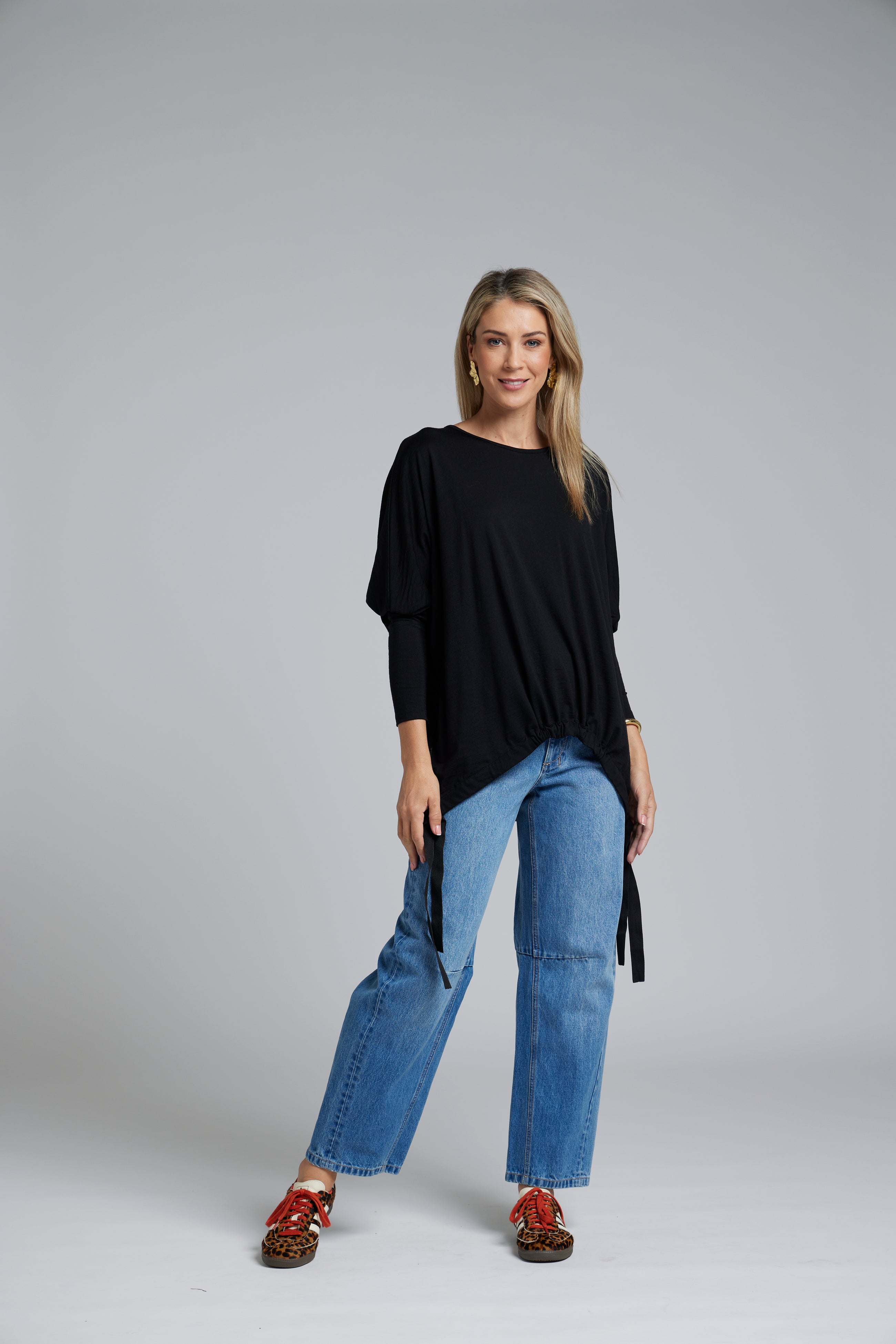 The NES Merino Vanotti Top – a warm merino take on the N-E-S favourite with cigarette sleeves, scoop neck and signature draped hem. NZ made.