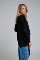 The NES Merino Vanotti Top – a warm merino take on the N-E-S favourite with cigarette sleeves, scoop neck and signature draped hem. NZ made.