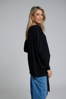 The NES Merino Vanotti Top – a warm merino take on the N-E-S favourite with cigarette sleeves, scoop neck and signature draped hem. NZ made.