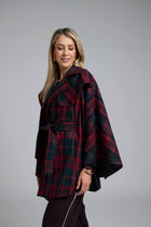 The NES Suri Cape by N-E-S – a trench-inspired wool cape with waist tie, lapel and full lining. A refined winter show stopper. NZ made.