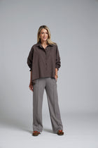 The NES Vey Shirt by N-E-S – a relaxed cotton shirt with 7/8 sleeves, three-row shirred cuffs and soft umbrella silhouette. In stripe or Kenzo Choc. NZ made.