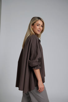 The NES Vey Shirt by N-E-S – a relaxed cotton shirt with 7/8 sleeves, three-row shirred cuffs and soft umbrella silhouette. In stripe or Kenzo Choc. NZ made.