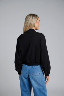 The NES Zadie Bomber by N-E-S – a clean ponte bomber with cotton rib trims and snap domes. Modern, versatile and NZ made. Available in Black or Latte.