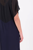 NES Norton Dress is a effortlessly chic chiffon piece that offers versatile styling options. With a flattering length that finishes just above the knee, this dress features a contrast top panel for added visual interest. Perfect for both dressing up or down, the Norton Dress can be worn alone or layered over skinny pants for a different look.