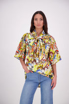 The N-E-S Nova Shirt blends the best of our Ayla, Mon, and Del shirts into one must-have wardrobe piece. Featuring elbow-length sleeves, a soft drop hem at the front and back, and a playful neck tie that can be styled multiple ways—bowed, looped, or reversed and tied at the back. Designed for versatility and charm, the Nova Shirt is a timeless addition to elevate your everyday style.

Our model is 174cm and wear a XS/S (8-10)

Composition: Cotton

Designed and Made in New Zealand