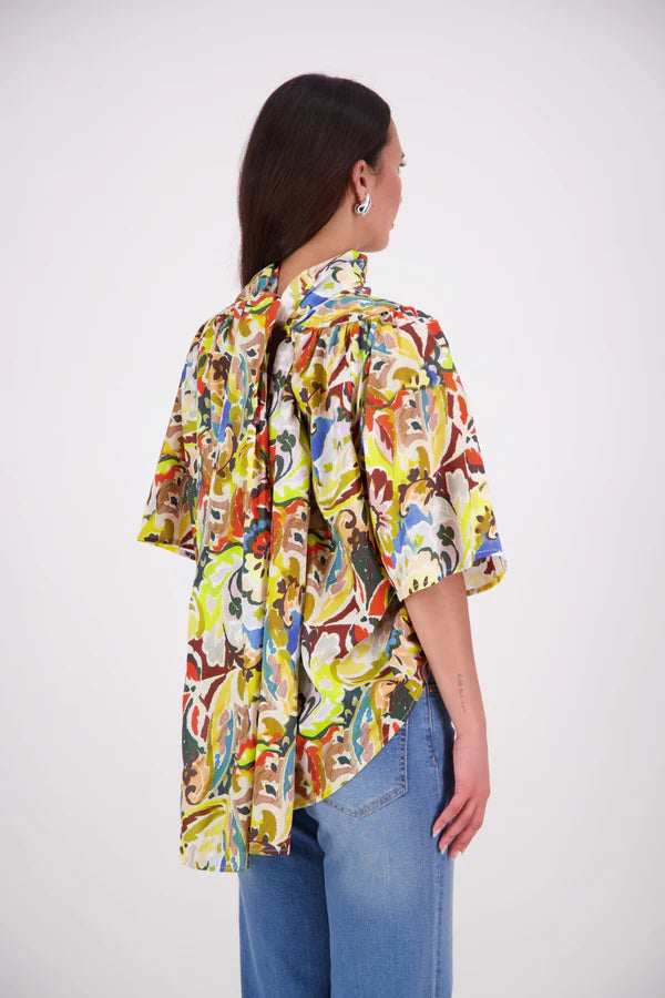 The N-E-S Nova Shirt blends the best of our Ayla, Mon, and Del shirts into one must-have wardrobe piece. Featuring elbow-length sleeves, a soft drop hem at the front and back, and a playful neck tie that can be styled multiple ways—bowed, looped, or reversed and tied at the back. Designed for versatility and charm, the Nova Shirt is a timeless addition to elevate your everyday style.

Our model is 174cm and wear a XS/S (8-10)

Composition: Cotton

Designed and Made in New Zealand