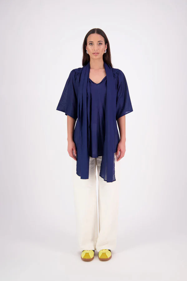 The N-E-S Nova Shirt blends the best of our Ayla, Mon, and Del shirts into one must-have wardrobe piece. Featuring elbow-length sleeves, a soft drop hem at the front and back, and a playful neck tie that can be styled multiple ways—bowed, looped, or reversed and tied at the back. Designed for versatility and charm, the Nova Shirt is a timeless addition to elevate your everyday style.
Our model is 174cm and wear a XS/S (8-10)
Composition: Cotton voile
Designed in New Zealand
