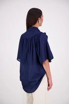 The N-E-S Nova Shirt blends the best of our Ayla, Mon, and Del shirts into one must-have wardrobe piece. Featuring elbow-length sleeves, a soft drop hem at the front and back, and a playful neck tie that can be styled multiple ways—bowed, looped, or reversed and tied at the back. Designed for versatility and charm, the Nova Shirt is a timeless addition to elevate your everyday style.
Our model is 174cm and wear a XS/S (8-10)
Composition: Cotton voile
Designed in New Zealand