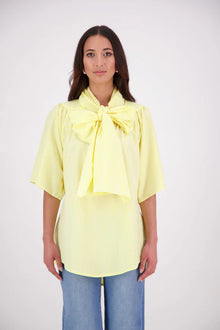 The N-E-S Nova Shirt blends the best of our Ayla, Mon, and Del shirts into one must-have wardrobe piece. Featuring elbow-length sleeves, a soft drop hem at the front and back, and a playful neck tie that can be styled multiple ways—bowed, looped, or reversed and tied at the back. Designed for versatility and charm, the Nova Shirt is a timeless addition to elevate your everyday style.

Our model is 174cm and wear a XS/S (8-10)

Composition: Cotton, bemburg&nbsp;

Designed and Made in New Zealand