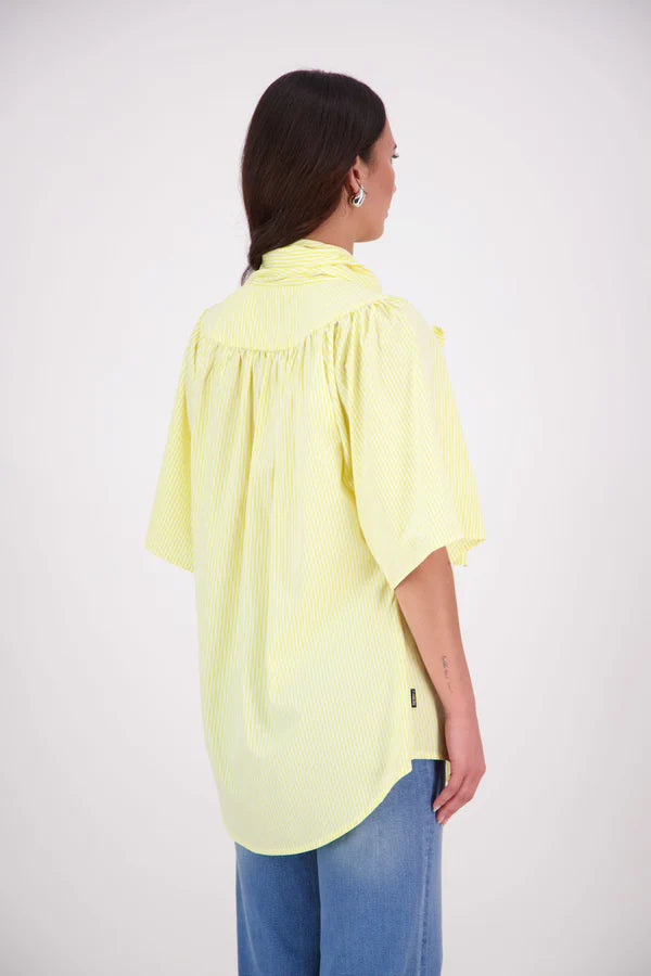 The N-E-S Nova Shirt blends the best of our Ayla, Mon, and Del shirts into one must-have wardrobe piece. Featuring elbow-length sleeves, a soft drop hem at the front and back, and a playful neck tie that can be styled multiple ways—bowed, looped, or reversed and tied at the back. Designed for versatility and charm, the Nova Shirt is a timeless addition to elevate your everyday style.

Our model is 174cm and wear a XS/S (8-10)

Composition: Cotton, bemburg&nbsp;

Designed and Made in New Zealand
