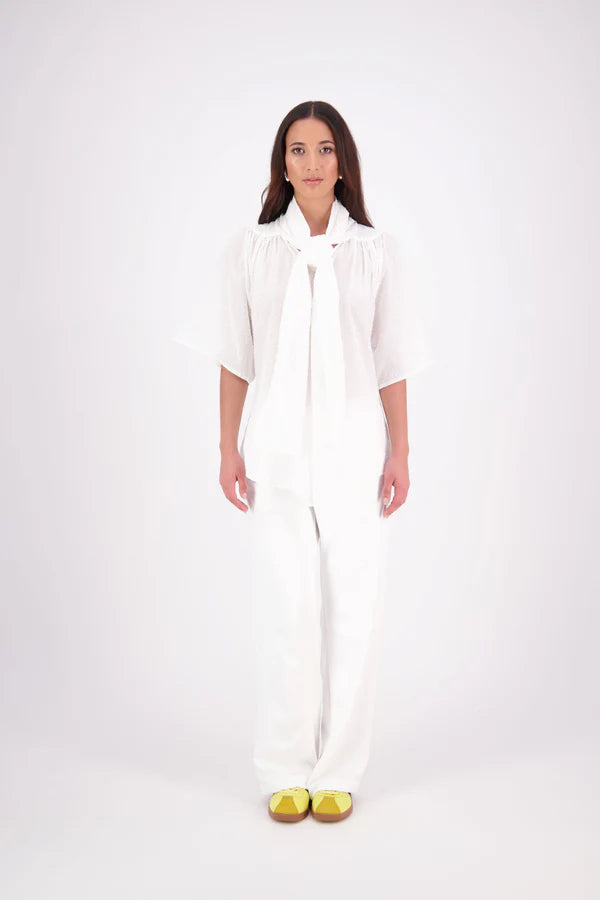 The N-E-S Nova Shirt blends the best of our Ayla, Mon, and Del shirts into one must-have wardrobe piece. Featuring elbow-length sleeves, a soft drop hem at the front and back, and a playful neck tie that can be styled multiple ways—bowed, looped, or reversed and tied at the back. Designed for versatility and charm, the Nova Shirt is a timeless addition to elevate your everyday style.

Our model is 174cm and wear a XS/S (8-10)

Composition: Cotton

Designed and Made in New Zealand