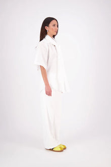 The N-E-S Nova Shirt blends the best of our Ayla, Mon, and Del shirts into one must-have wardrobe piece. Featuring elbow-length sleeves, a soft drop hem at the front and back, and a playful neck tie that can be styled multiple ways—bowed, looped, or reversed and tied at the back. Designed for versatility and charm, the Nova Shirt is a timeless addition to elevate your everyday style.

Our model is 174cm and wear a XS/S (8-10)

Composition: Cotton

Designed and Made in New Zealand