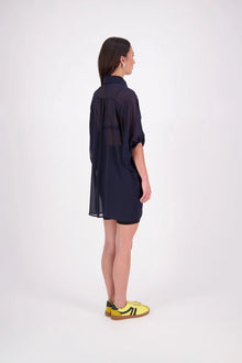 The N-E-S Oby Shirt Dress is a floaty chiffon piece with a batwing silhouette and tunic-length finish. Designed with a classic collar and centre front button-through placket, it features a waist loop and button so you can wear it loose and open or cinched for a more defined shape. Great worn on its own or styled back with slim or wide leg trousers or denim shorts for a relaxed, effortless look.

Our model is 174cm and wears a XS/S (8-10)

Composition: PT Chiffon

Designed and Made in New Zealand