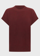 POL Astor Turtleneck Tee in a Yak and extrafine Merino blend, featuring a ribbed mock neck, dropped armholes and cap sleeves, finished with a relaxed fit and ribbed hem, available in Pebble and Wine