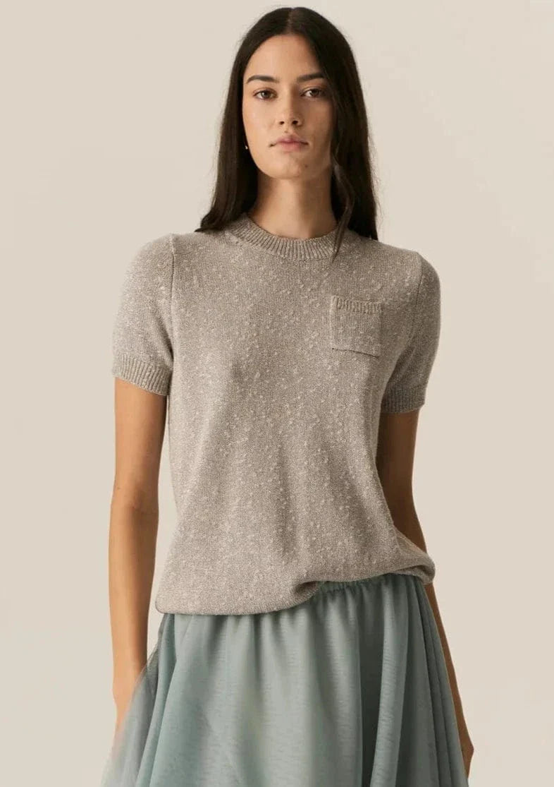 Our favourite knit tee gets a shiny new makeover! The POL Pax Lurex Tee features a &nbsp;natural textured stitch with a touch of metallic in two colour ways.
-Round ribbed neckline.
-Natural slub texture.
-Single pocket.
-Regular fit.
-Short sleeves with ribbed cuff.
-Ribbed hem.